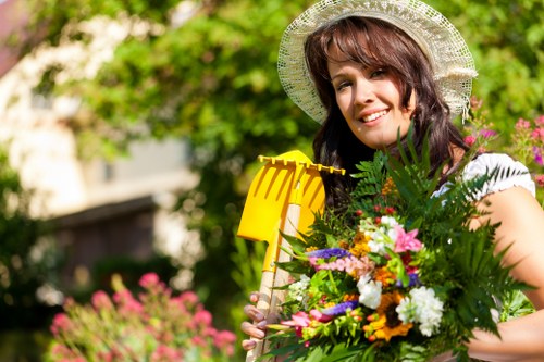 Gardening team providing an on-site free quote in a back garden