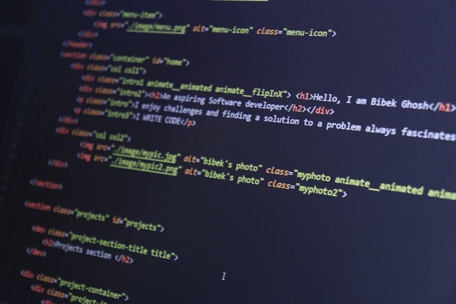 A close-up view of a computer screen displaying lines of colorful HTML code, including tags such as <h1>, <div>, and <img>. The code features various elements like headings, image source paths, and cl